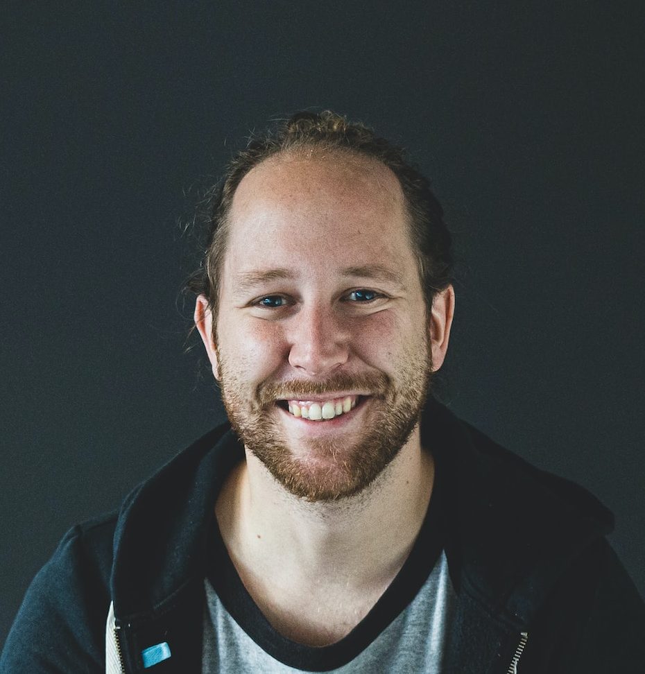 man in black jacket smiling